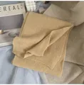 Detailed view of ginger yellow ribbed knit scarf texture with thick warm fabric - Milk Tea Camel
