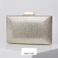 Elegant light gold evening clutch bag with herringbone glitter texture and metal clasp - Light gold
