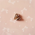 Detailed view of heart-shaped resin accessory with white swirls for DIY craft projects - Coffee Heart