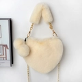 Detail of a beige heart-shaped faux fur bag with golden chain strap and fluffy pompom - Off White