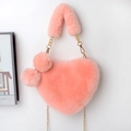 Detail showing the plush pink heart-shaped bag with soft faux fur texture and gold chain - Korean Pink