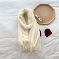 Close-up of soft cream white cashmere-like scarf with delicate short fringe details - Pure White