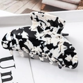 Detail shot of large marble-patterned acetate hair claw clip with glossy finish - S139-8 Black & White Ink Wash