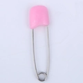 Pink smiley face safety pin for babies featuring a durable plastic head and metal body - Pink