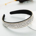 Fonkelende kristallen hoofdband met witte steentjes en gouden basis op antislip stof - Wit
