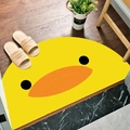 Semi-circular yellow bath mat with a cute duck face design for entryways - Cute Little Duck