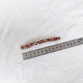 Dettaglio di un fermaglio per capelli in acetato da 10cm con trama marmorea e misurazione - Floreale Caffè