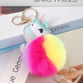 Close-up of a colorful unicorn keychain with soft gradient faux fur and gold metal ring - Silver 8-Figure Lobster Clasp / 8cm Rainbow Unicorn