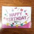 13-piece purple polka dot Happy Birthday foil balloons set in retail packaging display - Printed Pink
