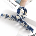 Detail of large acetate hair claw clip featuring blue and cream marble pattern - S137-9 Blue & White Tie-dye