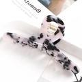 Detail of pink and white marble acetate hair claw clip on a stylish beauty magazine - S137-7 Pink White Black Marble