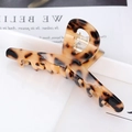 Macro shot of tortoiseshell acetate hair claw clip with leopard pattern and metal spring - S137-5 Classic Tortoise
