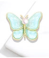 Elegante spilla a farfalla dorata con ali in marmo blu e perla bianca centrale - Blu