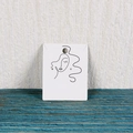White earring display card featuring black line art face pattern for jewelry packaging - 4.8x6.2CM