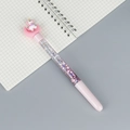 Sparkling pink unicorn liquid glitter pen with sequins on a grid notebook background - Pink Moon Unicorn