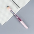 Pink cartoon pig liquid glitter pen with purple flowing sequins on a grid notebook - Pink Rod Pig Christmas Hat