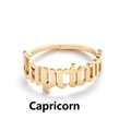 Macro shot of Capricorn gothic letter ring in gold-plated stainless steel with adjustable band - Capricorn / Gold