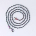 Macro shot of a 3mm rainbow stainless steel twisted rope chain necklace with lobster clasp - 60CM / Rainbow
