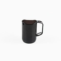 Minimalist black ceramic mug with unique hollow geometric handle and glossy finish - Brown