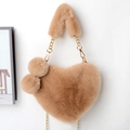 Detail of heart-shaped faux fur bag in camel with plush balls and gold chain strap - Light Khaki