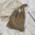 Camel woven tote bag with texture detail on a white bed for a minimalist aesthetic - Khaki