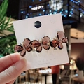 Elegant gold butterfly hair clip with amber crystals on a white display card - Butterfly Coffee Spring Clip