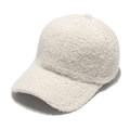 Detailed close-up of white fleece texture on a plush winter baseball cap for women - Off White
