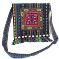 Close-up of Bohemian embroidered bag featuring colorful star patterns and beaded tassels - Blue Octagon Flower