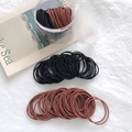 High elasticity hair ties in black and brown colors stored in a clear plastic jar - 100 Pieces Set / Black + Rust Red