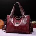 Retro burgundy faux leather tote bag with vintage texture and metallic hardware detail - Burgundy