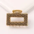 Detail of vintage gold alloy hair claw clip featuring caviar embossed hollow rectangular design - Rectangle - Antique Gold