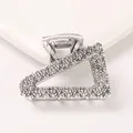 Detail view of antique silver geometric hair claw clip with rock texture surface - Triangle - Antique Silver