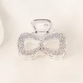 Detail of silver alloy hair claw featuring intricate hollow rose flower pattern carving - Bowknot - Silver