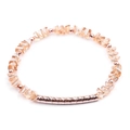 Detailed view of faceted champagne crystal beads with a hammered rose gold metal tube - Champagne