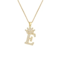 Macro shot of gold-plated letter E pendant with crown and shimmering zircon stones - Crown Letter E(E)