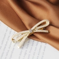Elegant gold pearl bow hair clip with rhinestones for women, soft silk background - Gold Lady Pearl Spring Clip