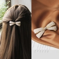 Elegant white pearl bow hair clip with gold metal base and rhinestone center detail - 3D Pearl Rhinestone Bow Spring Clip
