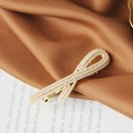 Golden bow hair clip with white pearls on a satin background for a sweet style - B-Rice Bead Ribbon Spring Clip