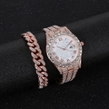 Macro detail of rose gold iced-out watch and Cuban link bracelet set on black stand - Rose Gold Set (black Box)