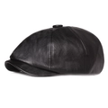 Detail view of the black PU leather newsboy hat showing the crown button and short brim - Black