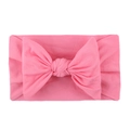 Pink soft nylon baby headband featuring a large bow for infants and toddlers - Pink