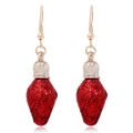 Close-up of red Christmas bulb earrings with sparkling glitter and golden hooks - Nautical Theme