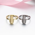 Adjustable pineapple rings in gold and silver finish on soft pink silk background - 015 (Pineapple Shape)