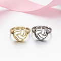 Macro shot of volleyball cut-out rings in gold and silver with S925 engraved band - 024 (Volleyball Texture)
