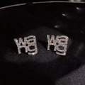 Luxurious S925 silver letter earrings with sparkling crystal pavé on black background - Letter Earrings - Silver