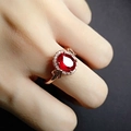18k rose gold plated ring featuring an oval red ruby crystal with white zircon halo - Adjustable Open / Red Stone Rose Gold