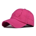 Close-up of bright pink distressed baseball cap with ripped fabric details and worn texture - Adjustable / Rose Red
