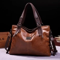Caramel brown vintage tote bag in soft leather with dark coffee straps and metal logo - Brown