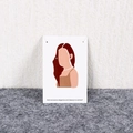 Silver stud earrings displayed on white paper card with elegant female illustration - Style KP126 / 100 Pcs/Pack