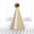 Conical paper party hat with gold and white zigzag patterns and a plush pompom on top - White Wave Pattern